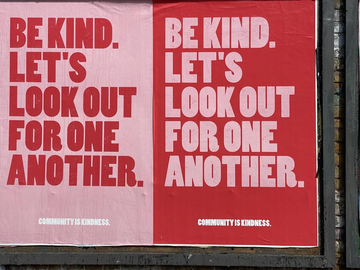 A poster with the words "Be kind. Let's look out for one another".