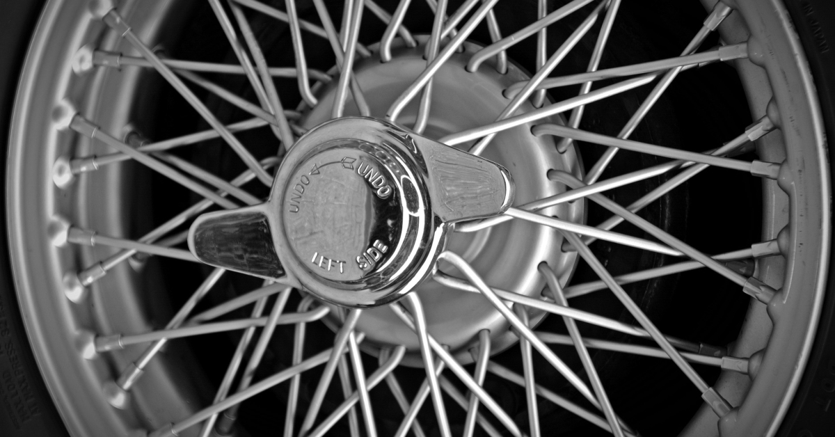 An image of an old car wheel with spokes