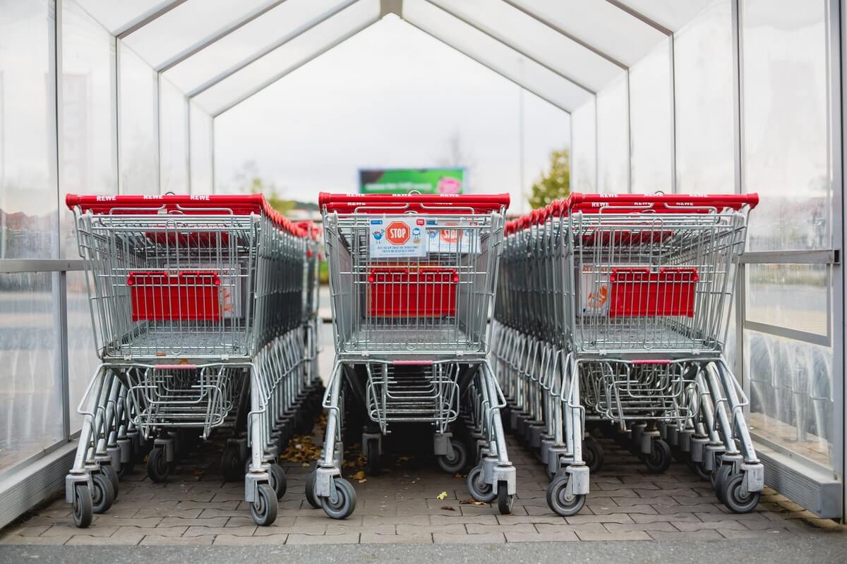A photograph of trolleys at a supermarket