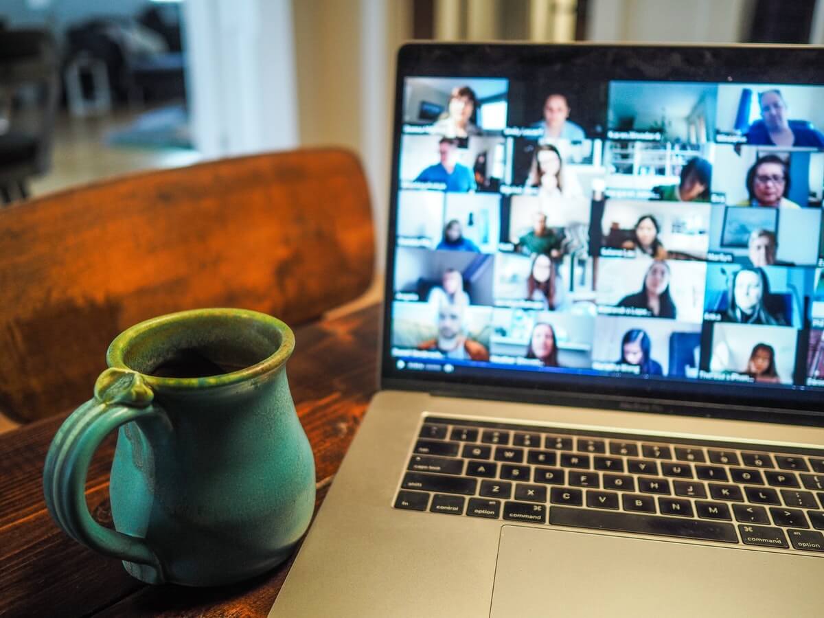 An image of a laptop showing a virtual meeting.